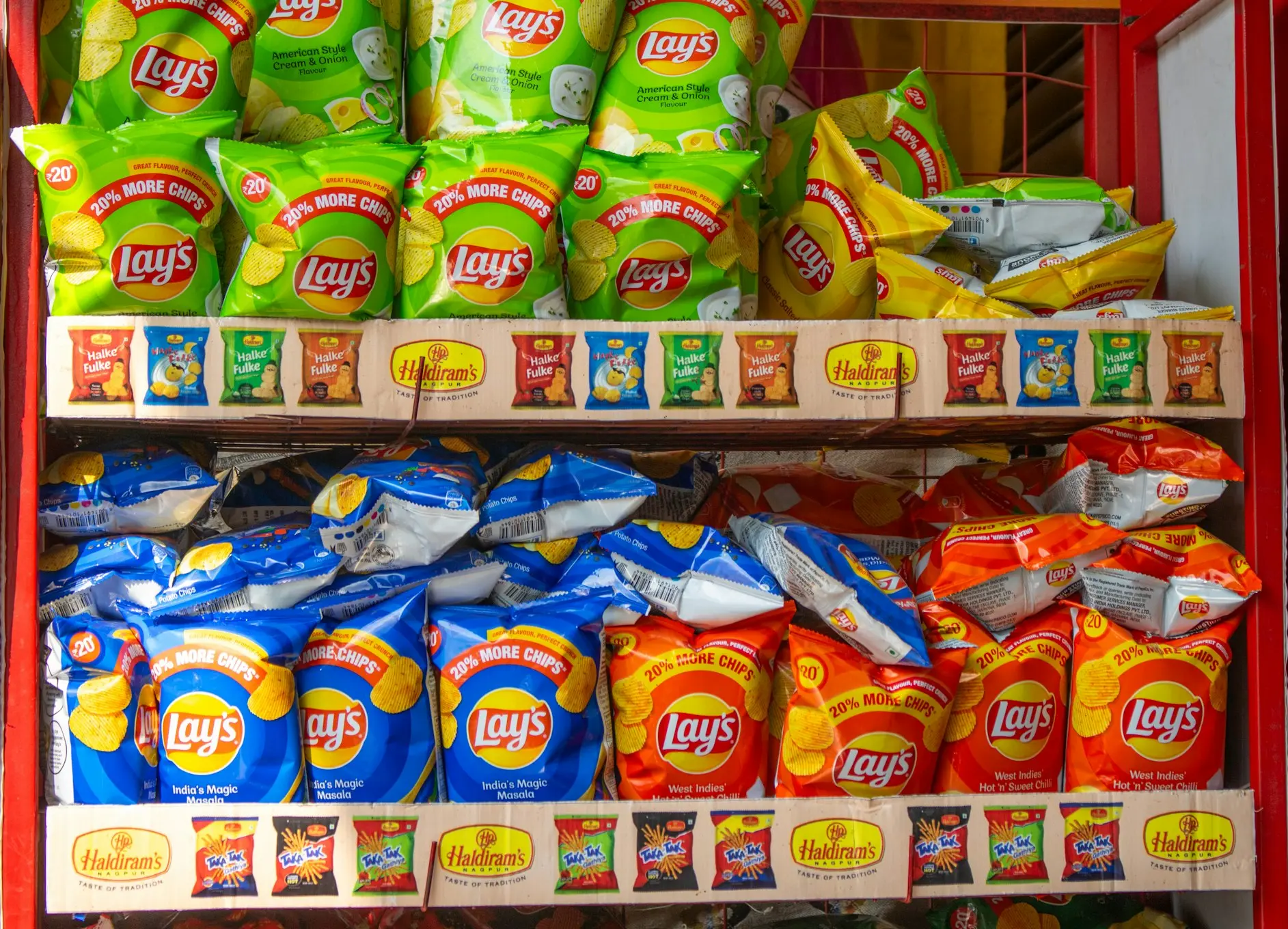 A shelf filled with lots of different types of food
